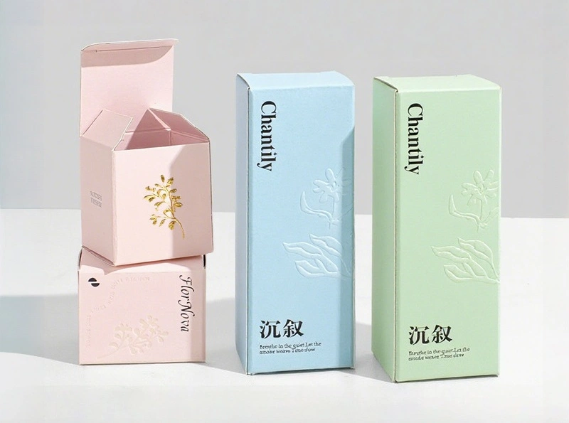 Custom-printed white cardboard subscription box with gold foil logo for a monthly skincare kit.