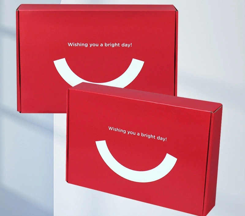 Custom branded red mailer box with gold foil logo stamp