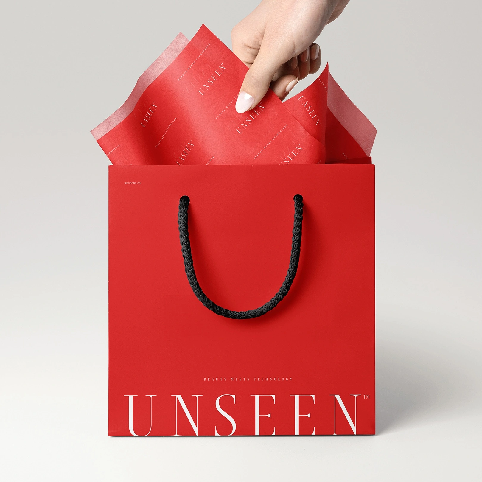 red paper bag with tissue paper