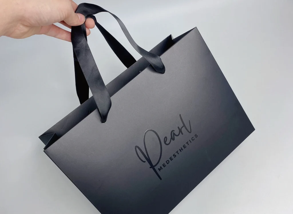 Luxury paper gift bag with UV stamped logo