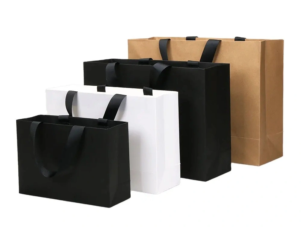 Paper shopping bags with strong glued handles