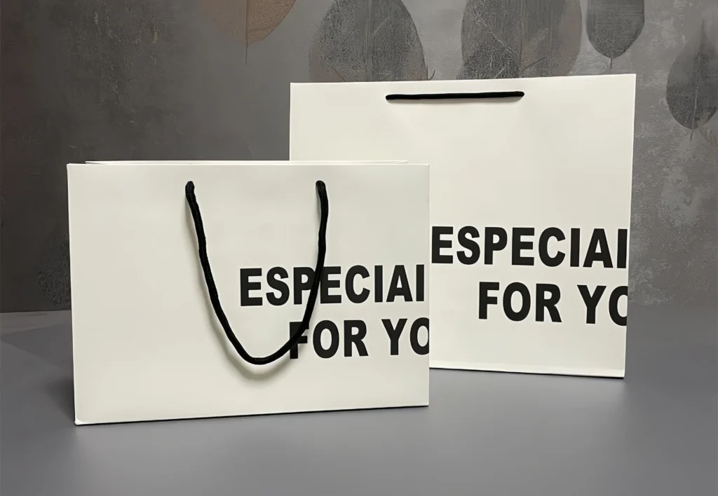 Clean and modern white paper bag with black logo