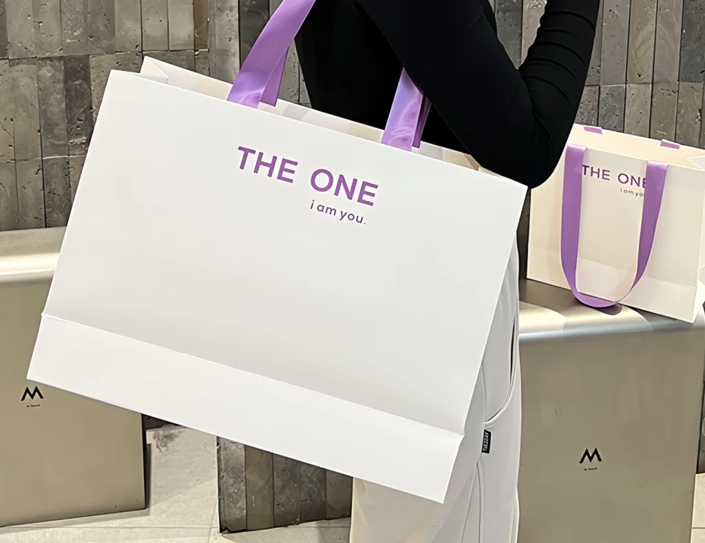 Clothing store shopping bags displayed in a retail store environment