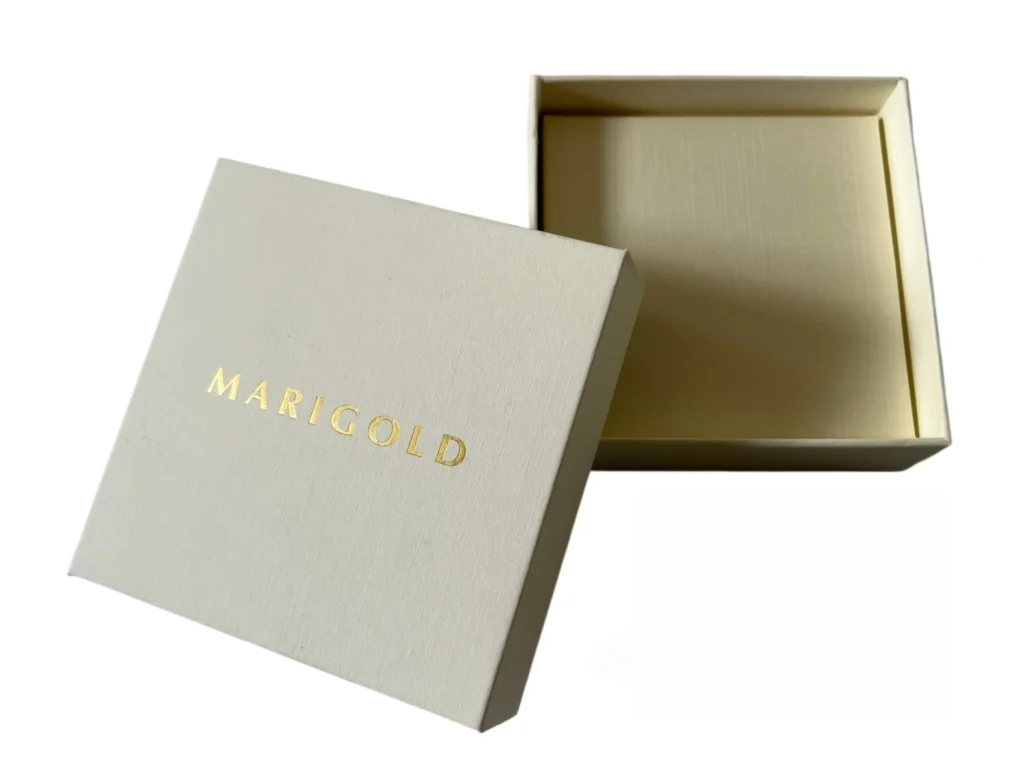 Necklace displayed in a jewelry box with a fitted necklace card insert